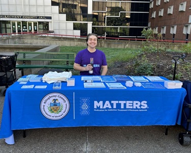 Matthew-Bequeath-of-MATTERS-oversees-his-table-at-the-resource-fair