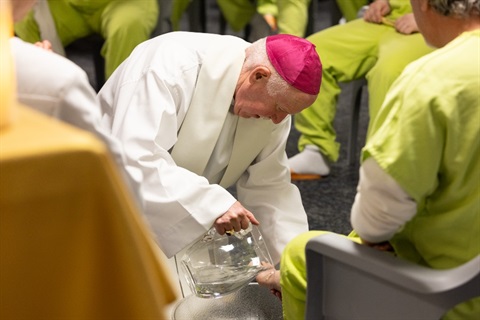 Bishop-Eckman-pours-water-for-the-foot-washing-ceremony.jpg
