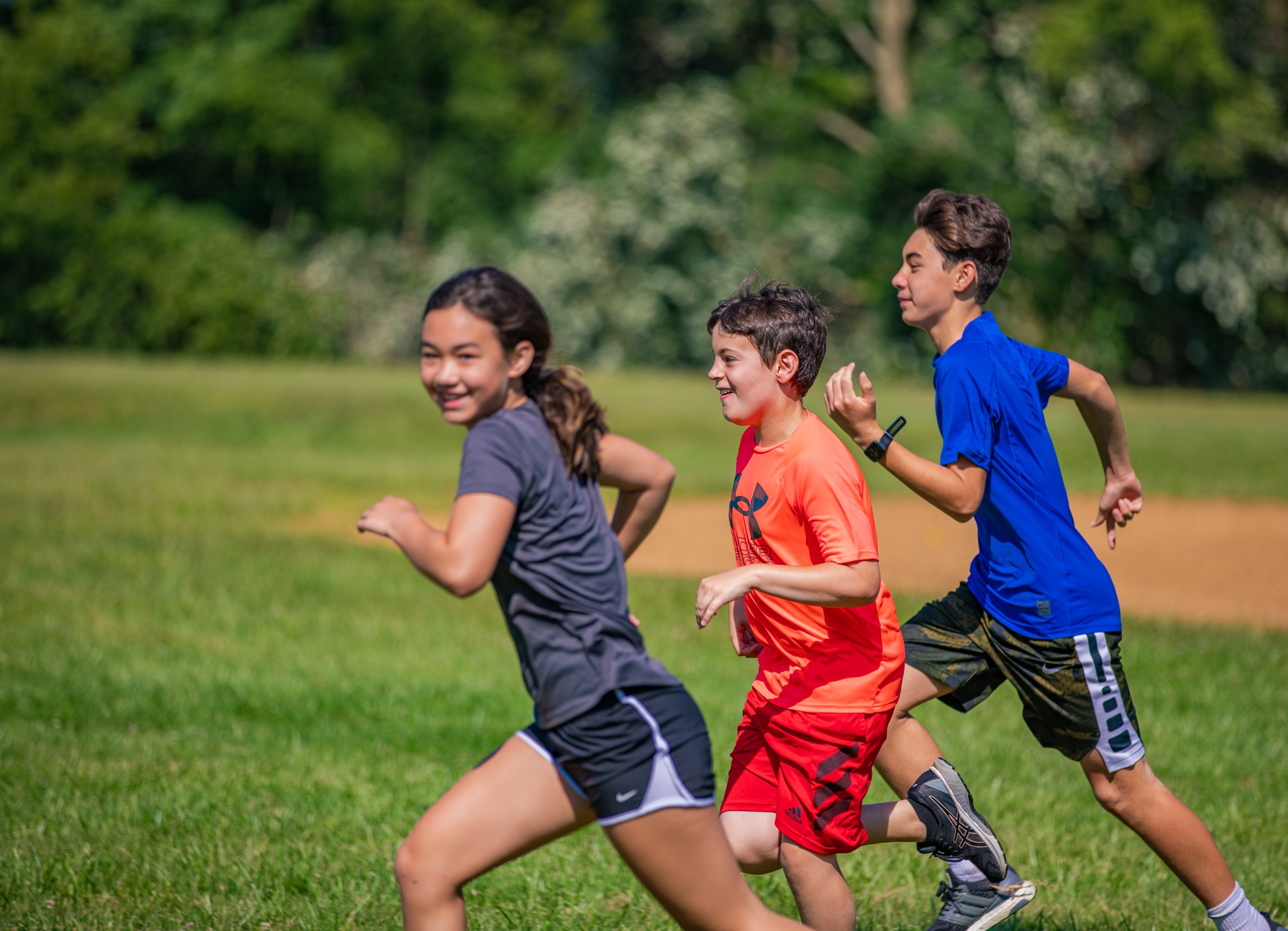 children running in a field