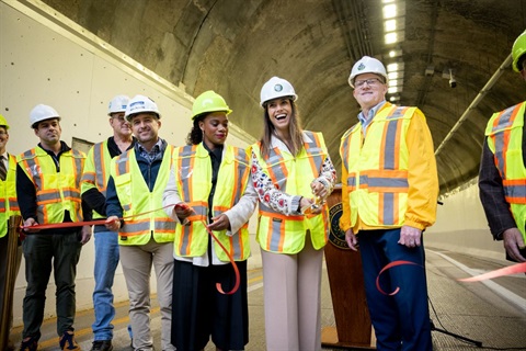 County Executive Sara Innamorato, Congresswoman Summer Lee, Public Works Director Stephen Shanley, P.E., and others cut a ribbon to celebration completion of an Armstrong Tunnel rehabilitation project