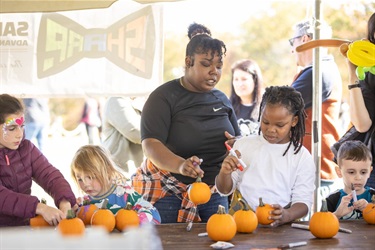Face painting and pumpkin crafts are a lot of fun!